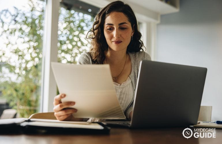 Woman preparing requirements for ABD PhD Completion