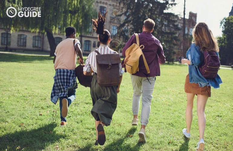 english degree students running across campus