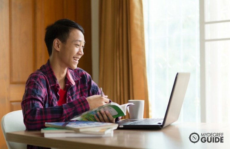 Biology student studying online at home