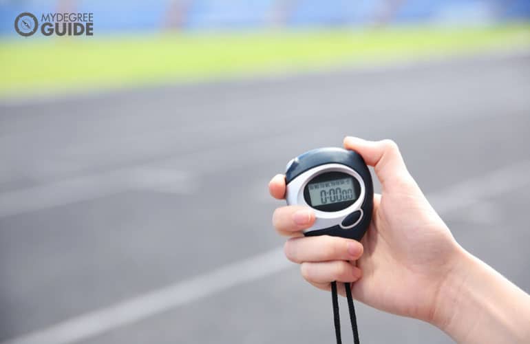 someone holding a stopwatch