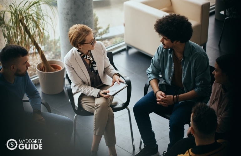 social worker in a group counseling