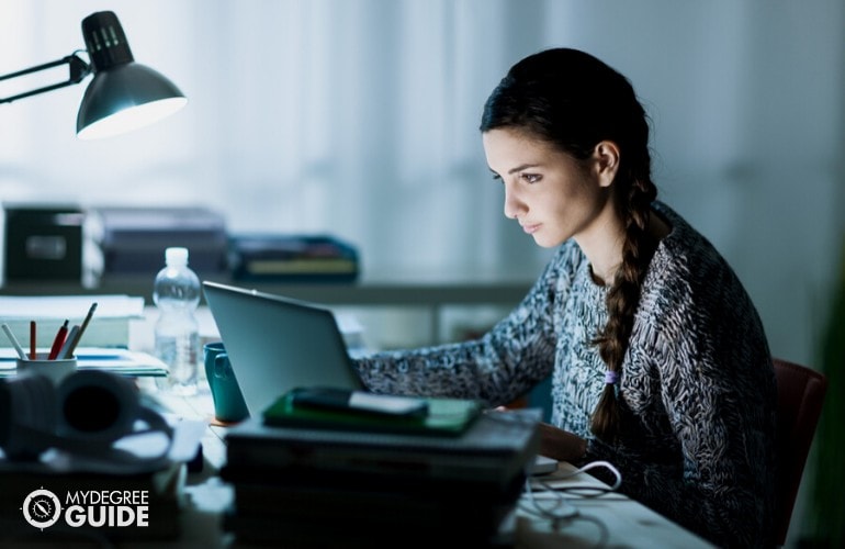 student working on her laptop