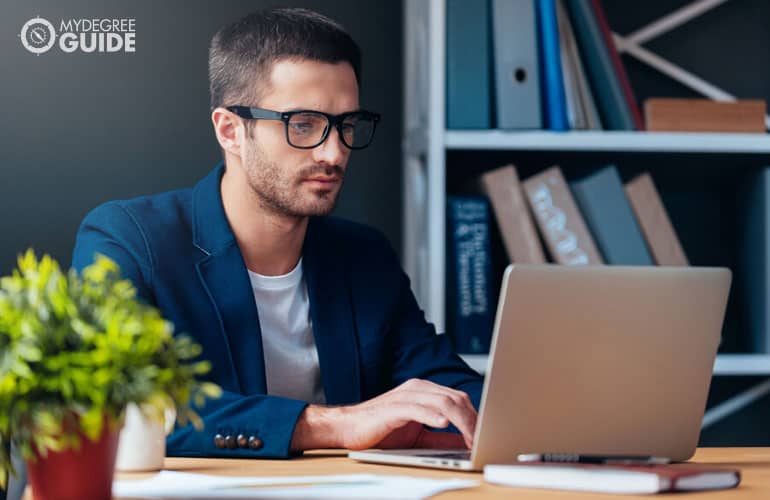 male employee working on his laptop