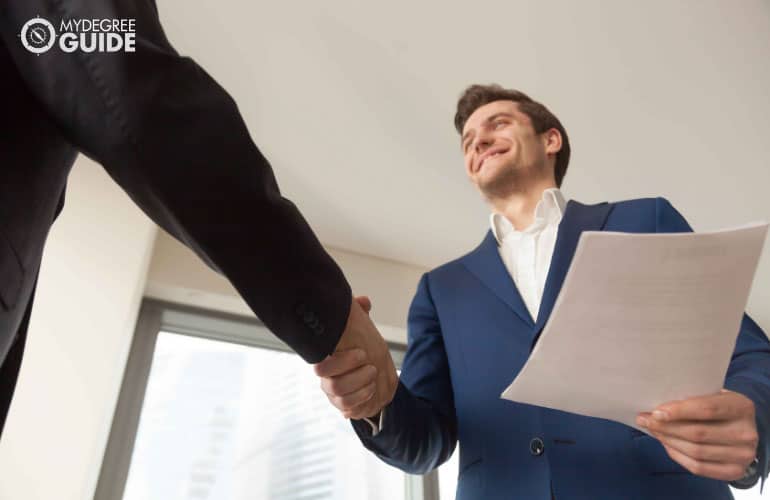 people shaking hands after an interview