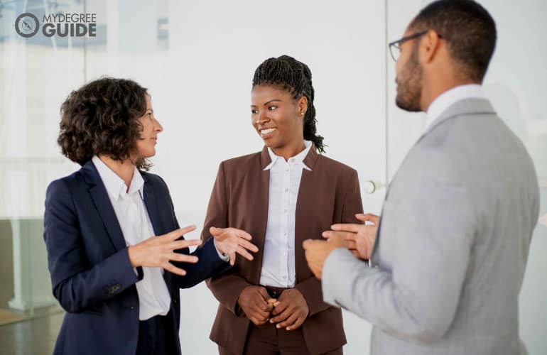 professionals chatting and smiling