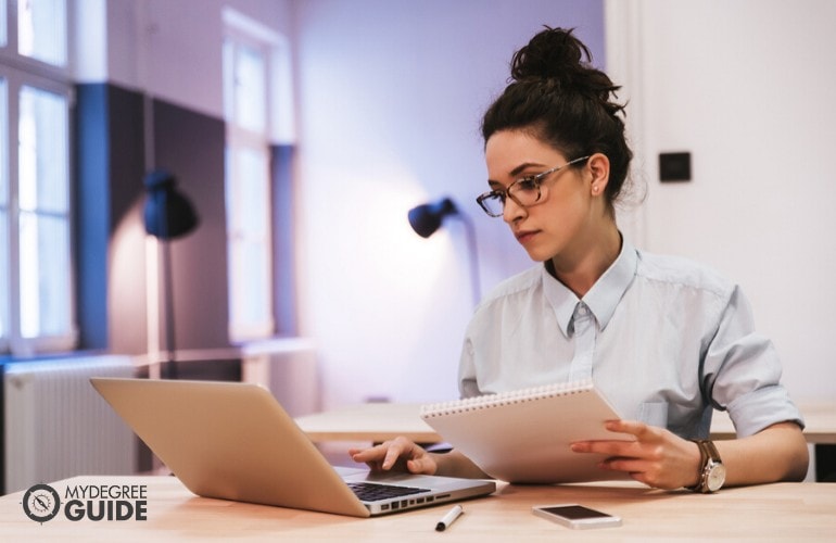 accounting student studying on her laptop