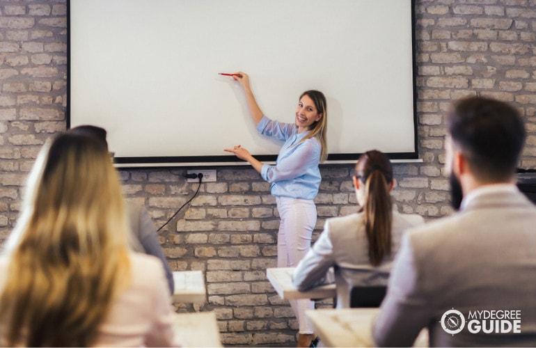 college students inside university classroom