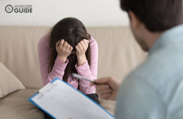 psychologist and his patient in an office