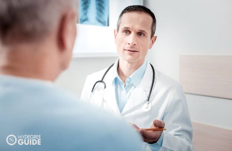 medical social worker talking to a patient in a clinic