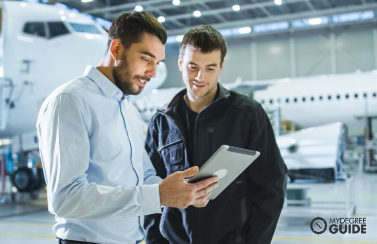 Aerospace Engineer giving instructions to Engine mechanic