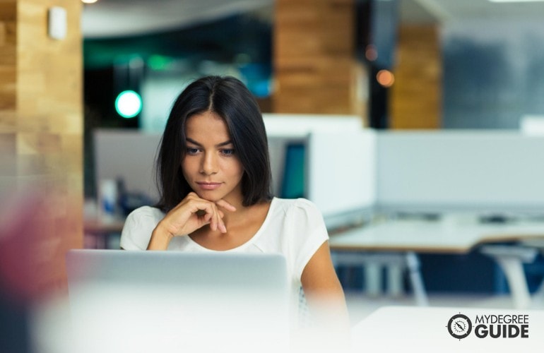 Cyber Security Master’s Degree student studying in a cafe