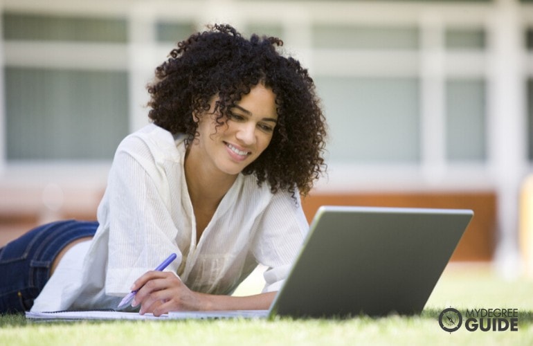 public health student studying on her laptop