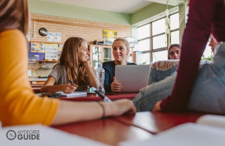 students talking in class