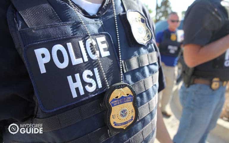 homeland security officer patrolling community college