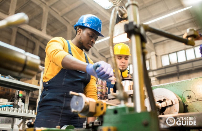 Industrial engineering technicians working together