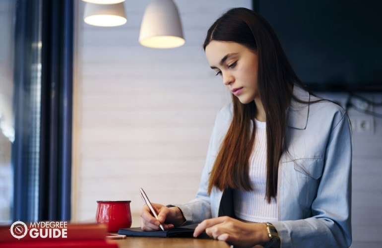 liberal arts student studying at a cafe