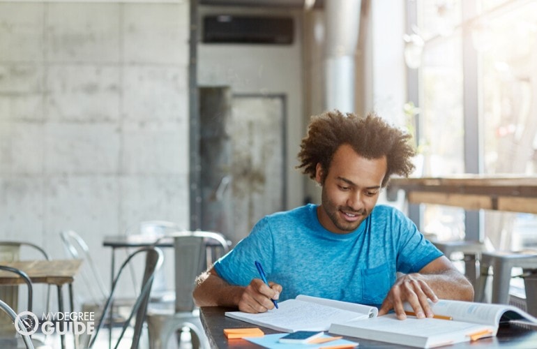 liberal arts student studying at a cafe