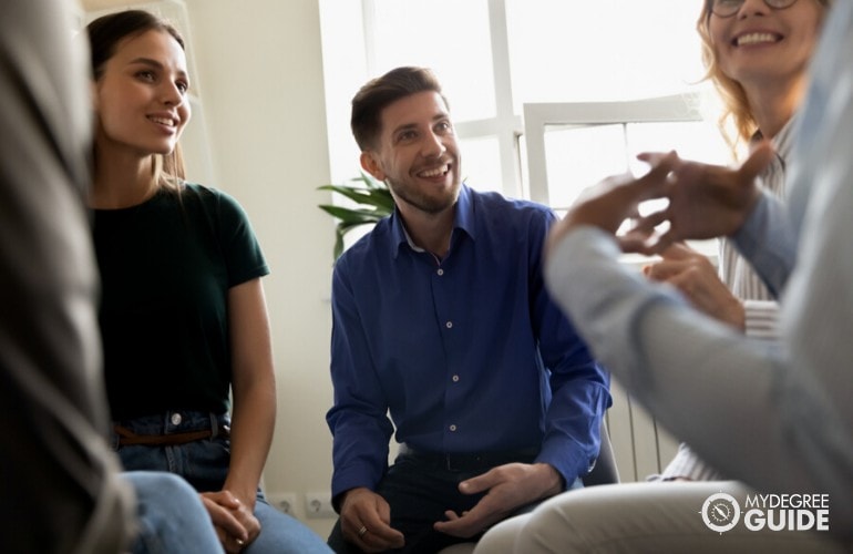 psychologist sharing their experiences during a meet up