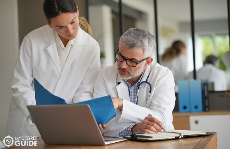 nurse manager consulting a medical doctor in a hospital