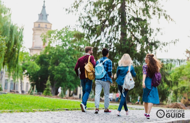 students walking into college building