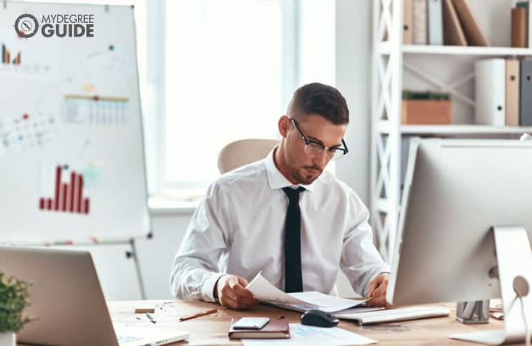 businessman sitting at desk in office