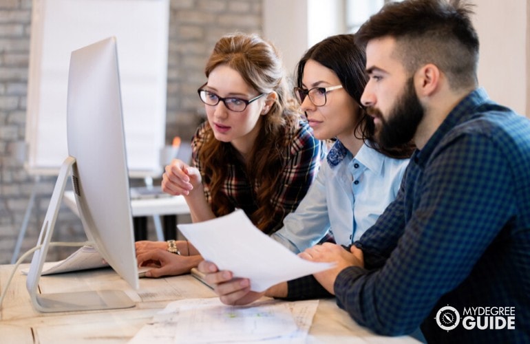 Computer engineers working together on a project