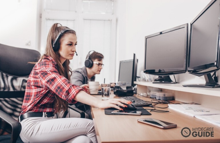 Software Engineers working on their computer in the office