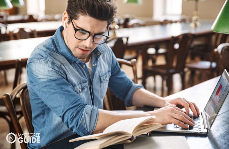 History Degree Student studying at a canteen