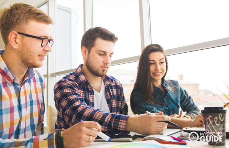 Information Systems students studying together