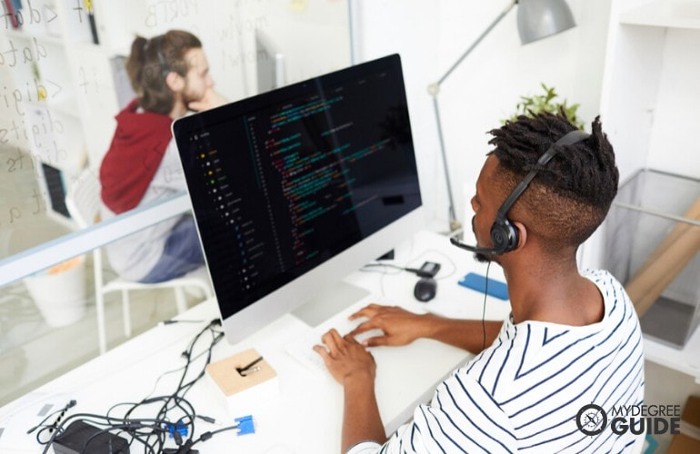 web developer working on his computer