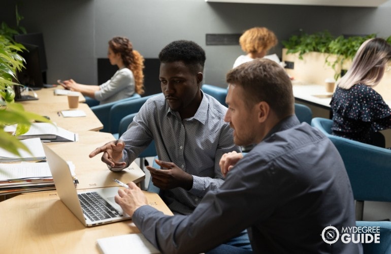 business manager talking to a staff