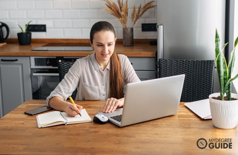 bachelor's in social work student studying online at home