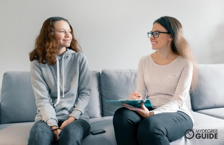 counselor talking to a teenager