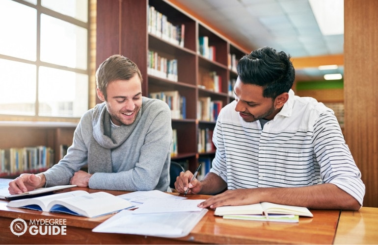 students studying in college library