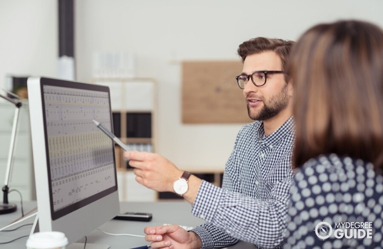 Cyber Security Analysts working in the office