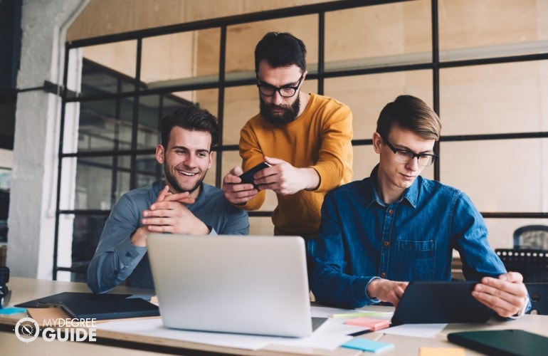 Cyber Security Degree students studying online together