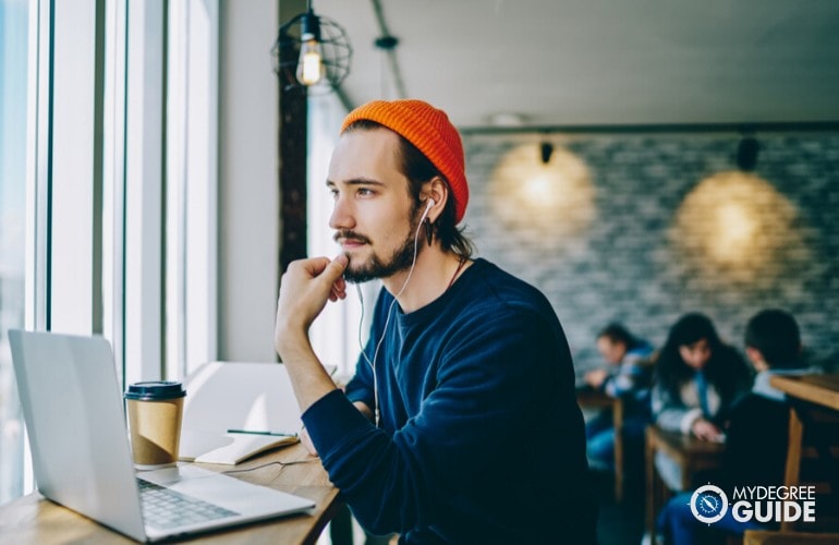 liberal arts degree student studying at a cafe