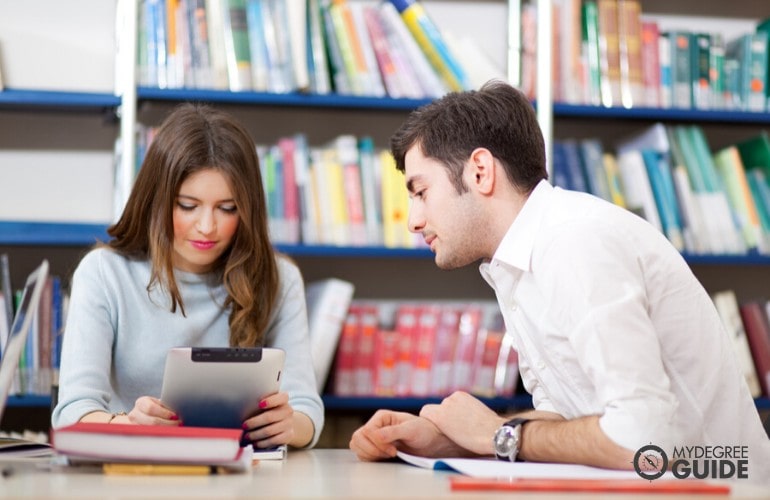 Masters Degree in Teaching students studying in library