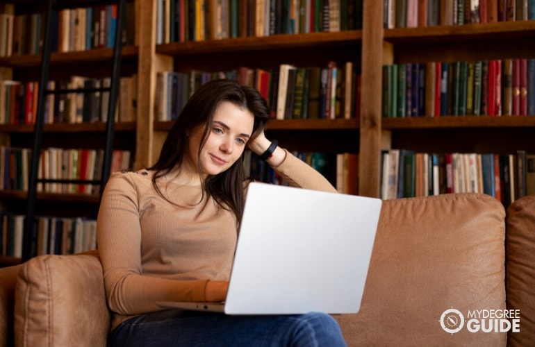 psychology student studying in her library