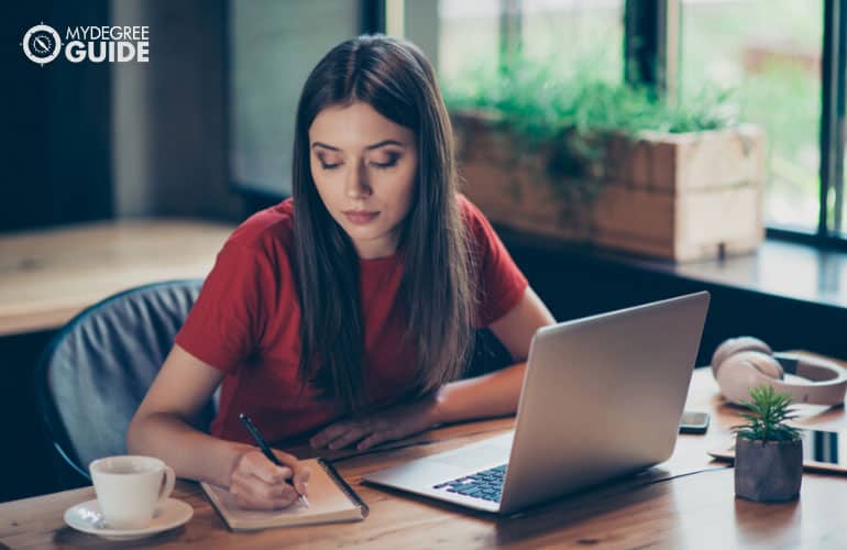 student studying online in a cafe