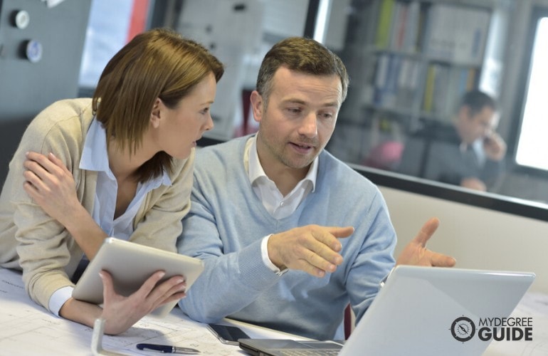 Operations Manager talking to a staff in the office