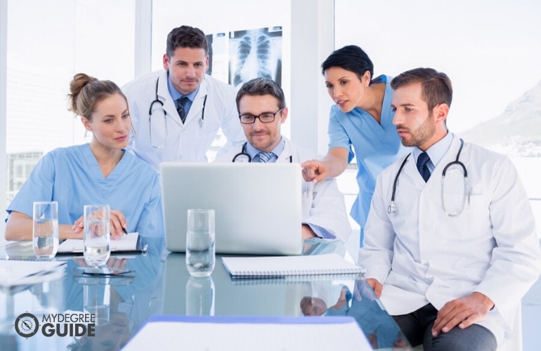 health services manager meeting with his staff