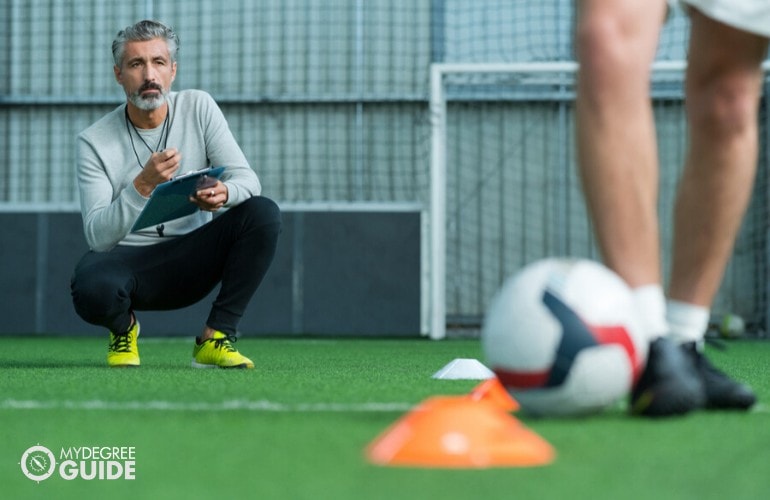 Soccer coach training his team