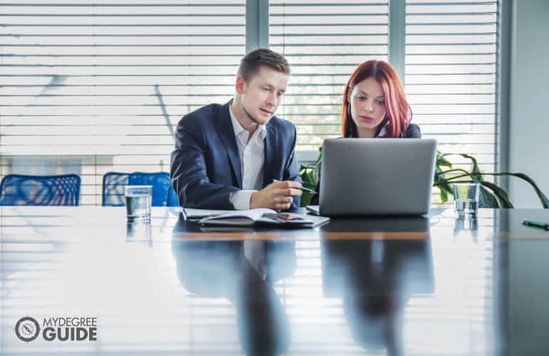 employees discussing a project in the office