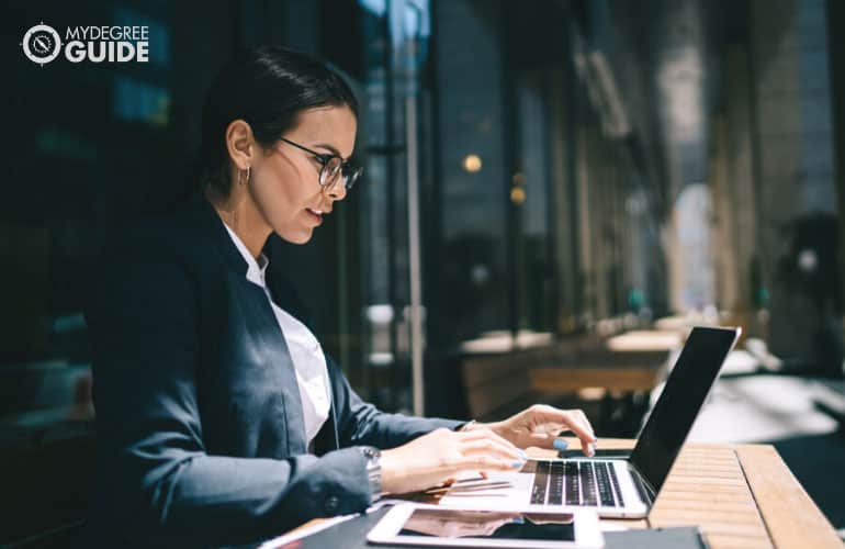 female economist working on her laptop