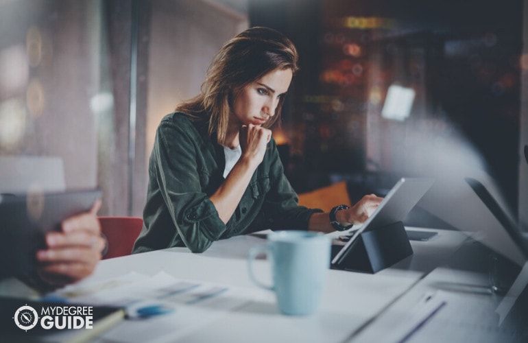 business analyst working on her laptop