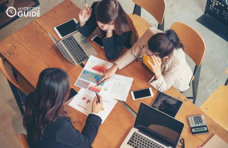 business analysts discussing during a meeting