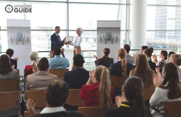 professional receiving a certificate