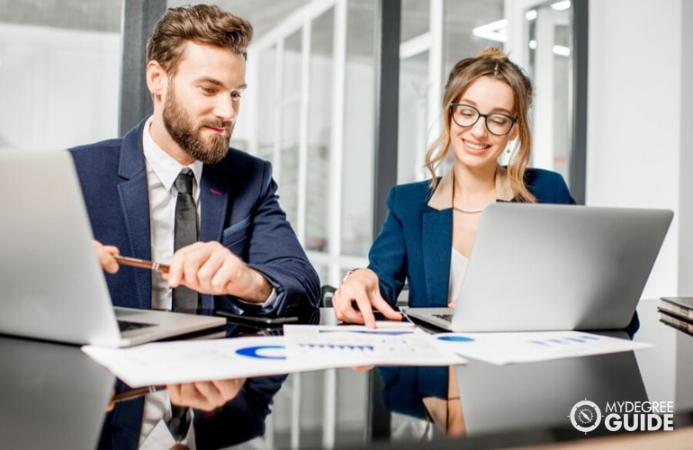 business analysts working in the office together