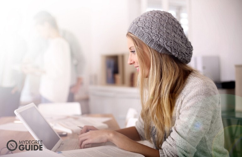 General Studies Degree student studying on her laptop